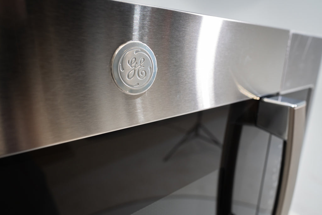 Pictures of GE Over-The-Range Sensor 1.9 Cu. Ft. Microwave Oven with Filter Indication Light and Steam Clean JVM7195SKSS - New in Box - Neu Appliance Outlet - Discount Appliance Outlet in Austin, Tx