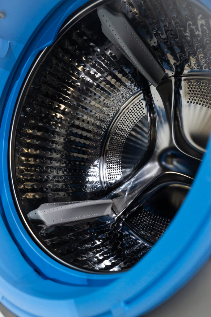 GE Profile PFQ97HSPVDS Close-up of a washing machine drum with blue exterior