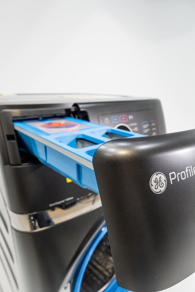 GE Profile PFQ97HSPVDS GE Profile machine with a blue tray inside, on a white background