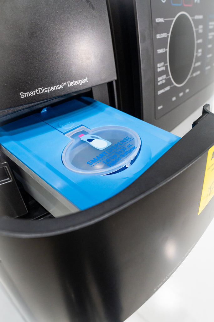 GE Profile PFQ97HSPVDS Smart Dispense detergent dispenser with blue lid on a white background