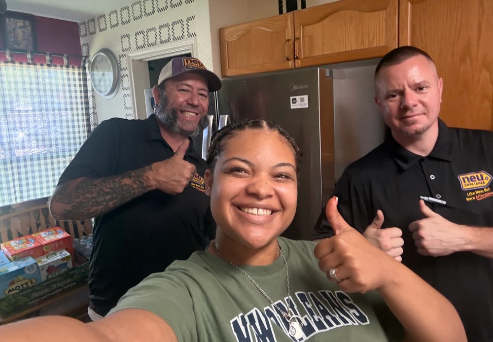 Happy Neu Appliance Outlet customer with our delivery team
